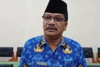 Kepala Dinas Pendidikan Trenggalek, Agoes Setiyono saat dikendarai oleh awak media, Senin (17/11/2025).