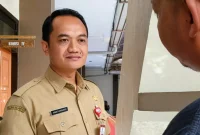 Kepala Dinas Pendidikan Trenggalek Agus Dwi Karyanto saat dikonfirmasi awak media usai ikuti rapat dengar pendapat di DPRD Trenggalek dengan GMNI, Senin (18/5/2026).
